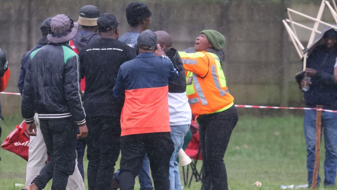 A marshal trying to calm down angry Manzini Sea Birds supporters during the mini-commotion at the Prince of Wales Sports Ground yesterday. (Pic: Melusi Mkhabela)